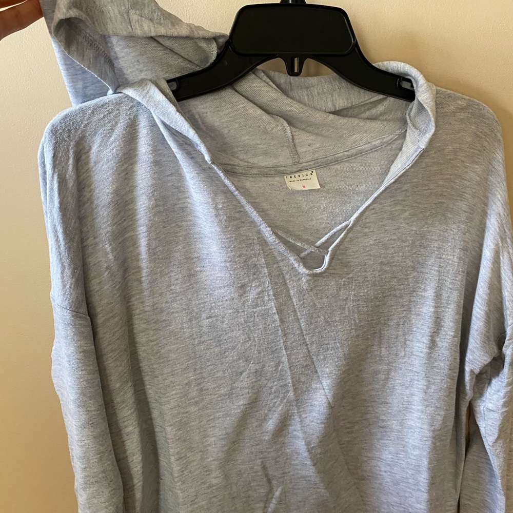 Light blue hooded long sleeve ! Very light material .